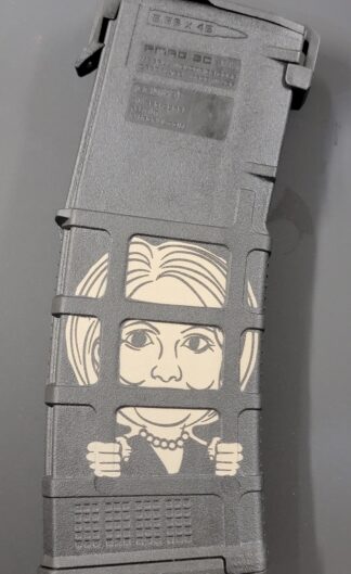 DESCRIPTION The next-generation Hillary Behind Bars Laser Engraved  Magpul PMAG 556 AR15 GEN M3 is a 30-round polymer magazine for AR15/M4 compatible weapons chambered in 5.56x45 NATO / .223 Remington. Along with expanded feature set and compatibility, the GEN M3 incorporates new material technology and manufacturing processes for enhanced strength, durability, and reliability that exceed rigorous military performance specifications. While the GEN M3 is optimized for Colt-spec AR15/M4 platforms, modified internal and external geometry also permits operation with a range of additional weapons, such as the HK® 416/MR556A1/M27 IAR, British SA-80, FN® SCAR™ MK 16/16S, and others. Similar to the MOE® PMAG, the GEN M3 features a long-life USGI-spec stainless steel spring for commonality, a four-way anti-tilt follower, constant-curve internal geometry for reliable feeding, and simple tool-less disassembly for easy cleaning. The PMAG 30 GEN M3 also includes a redesigned bolt catch notch in the rear of the magazine that provides increased bolt catch clearance, while an over-travel stop on the spine helps ensure the magazine will not over-insert on compatible weapons. Low profile ribs and new, aggressive front and rear texture give positive control of the GEN M3 in all environments, and a paint pen dot matrix has been added to the bottom panel of the body to allow easy marking for identification. The new, easy to disassemble flared floorplate aids extraction and handling of the magazine while providing improved drop protection, but is slightly slimmer than before for better compatibility with tight double and triple magazine pouches. An included pop-off impact / dust cover can optionally be used to minimize debris intrusion and protect against potential damage to the top cartridge during storage and transit. Made in the U.S.A. Magazine Restricition apply in Terms and conditions Check out our Laser Engraved Mags
